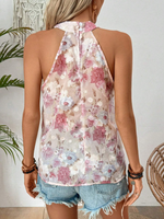 Maglietta estiva senza maniche, con incrocio di alle spalle e stampa floreale per donna