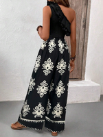 Top canotta asimmetrica con volant e spallina singola e pantaloni a gamba larga con stampa hawaiana