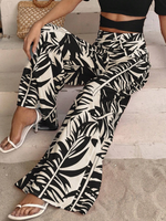 Pantaloni a gamba larga con stampa tropicale