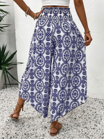Pantaloni stampati a gamba larga, a vita alta e a svasati per donne in vacanza con orlo a balze