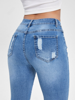 Jeans skinny strappati tasca inclinata