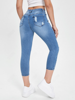 Jeans skinny strappati tasca inclinata