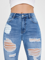 Jeans skinny strappati tasca inclinata