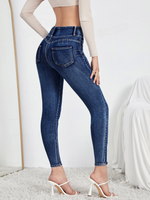 Jeans skinny strappati dettaglio bottone