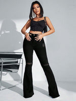 Jeans a gamba svasata vita alta con strappati