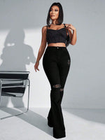 Jeans a gamba svasata vita alta con strappati