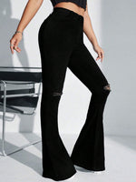 Jeans a gamba svasata vita alta con strappati