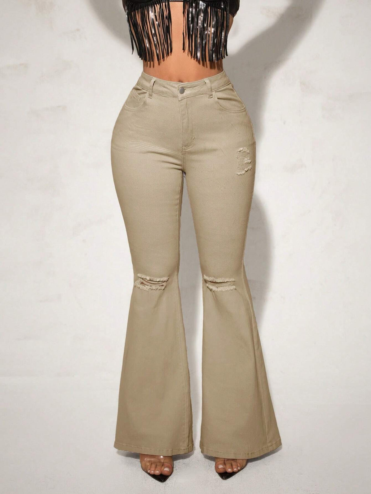 Jeans a gamba svasata vita alta con strappati